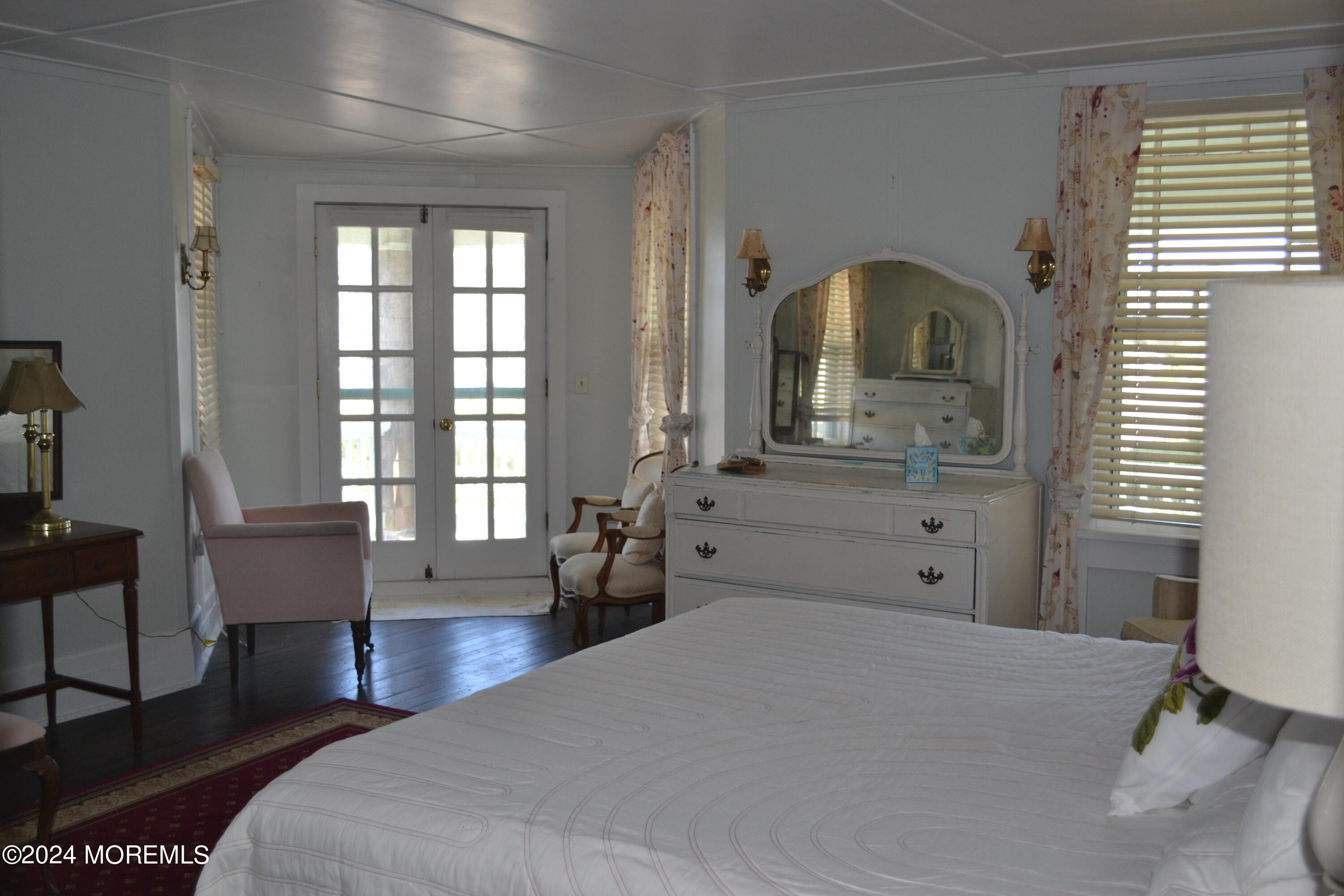 18 Bridge Avenue Bay Head, NJ 08742 - Photo 11 of 20 a bedroom with a bed and wooden floor