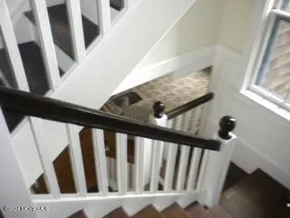 a backyard of a house with outdoor seating