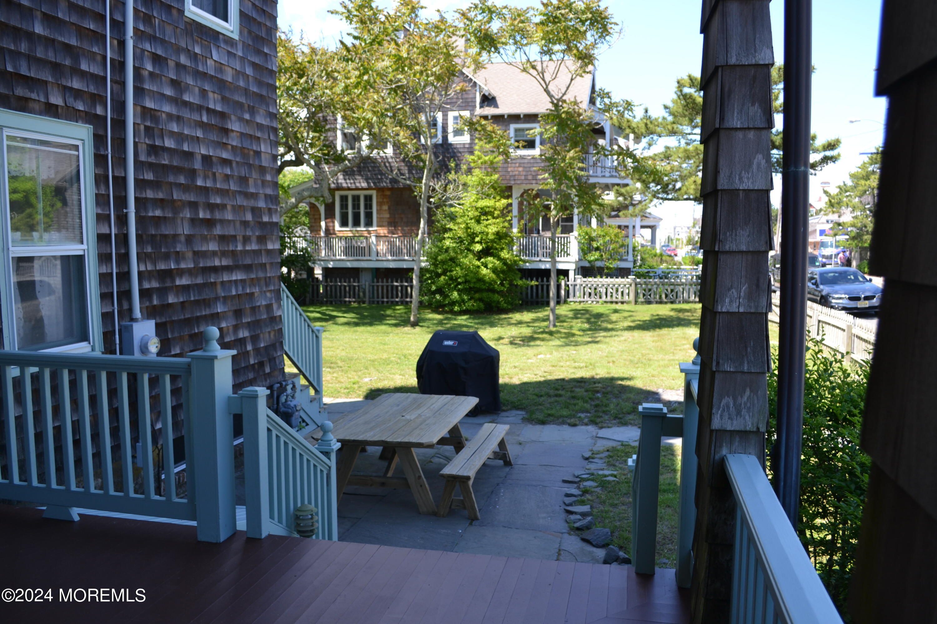 18 Bridge Avenue Bay Head, NJ 08742 - Photo 19 of 20 a view of a chairs and table in patio with a yard