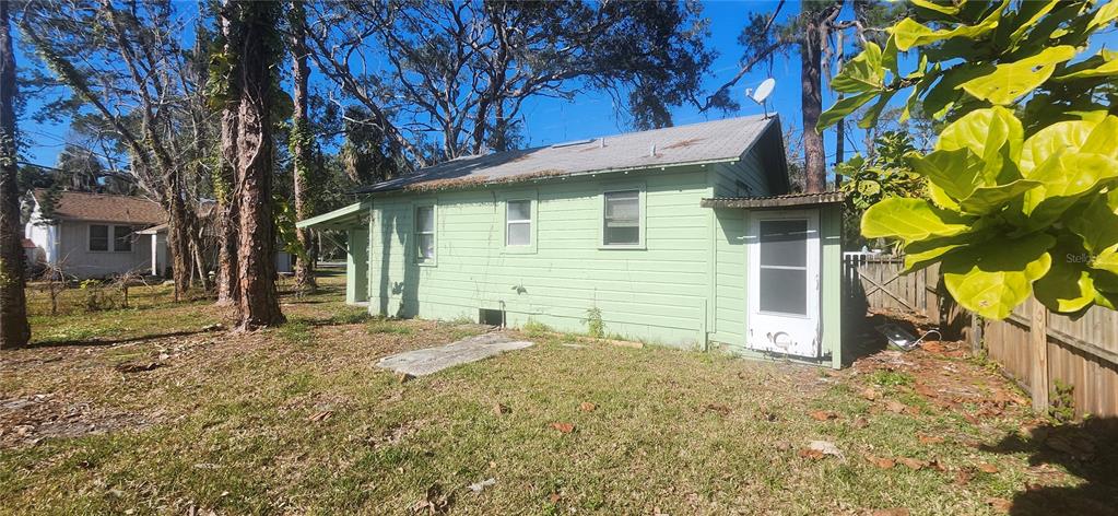 5212 Limestone Drive Port Richey, FL 34668 - Photo 11 of 17 a backyard of a house with table and chairs