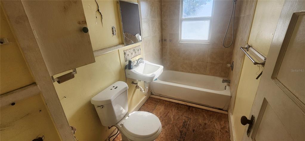 5212 Limestone Drive Port Richey, FL 34668 - Photo 4 of 17 a white toilet sitting next to a bath tub