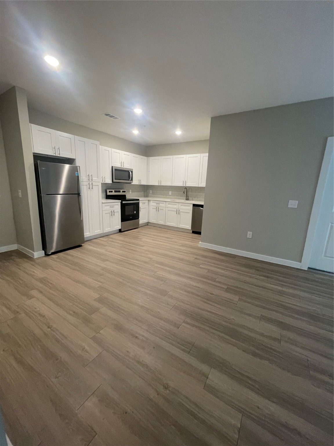 20525 Ella Boulevard, Unit 4109 Spring, TX 77388 - Photo 4 of 7 a view of a kitchen with a sink and a refrigerator