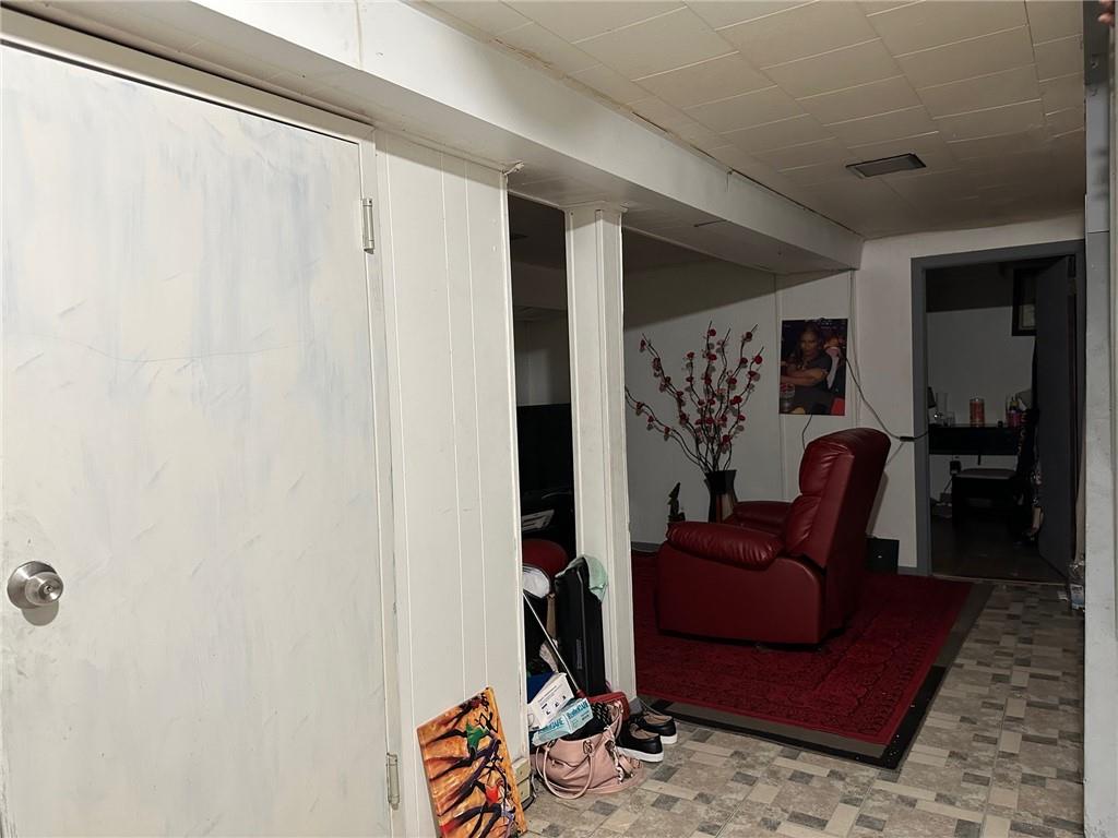 143-20 182nd Place Queens, NY 11413 - Photo 13 of 17 a living room with furniture and a rug