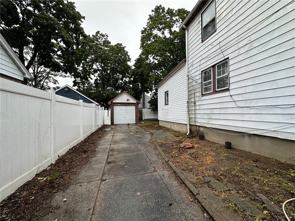 143-20 182nd Place Queens, NY 11413 - Photo 17 of 17 a view of a small white house with large trees