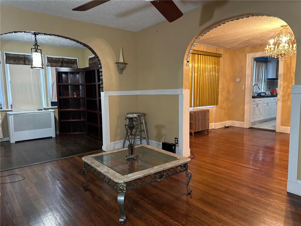 143-20 182nd Place Queens, NY 11413 - Photo 4 of 17 a view of a dining room with furniture and wooden floor
