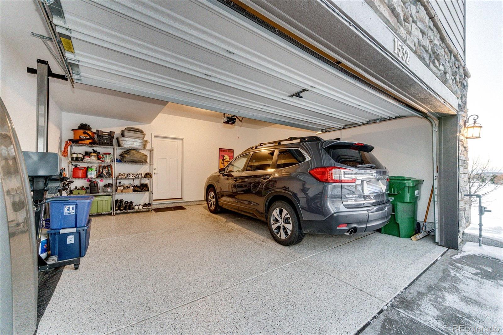1532 Castle Creek Circle Castle Rock, CO 80104 - Photo 30 of 39 a car parked in garage