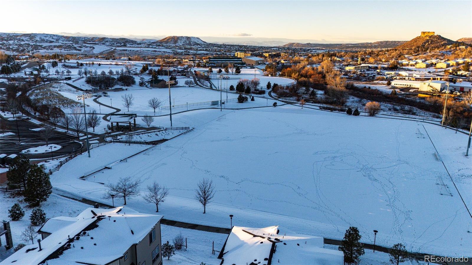 1532 Castle Creek Circle Castle Rock, CO 80104 - Photo 37 of 39 an aerial view of a city with lots of residential buildings