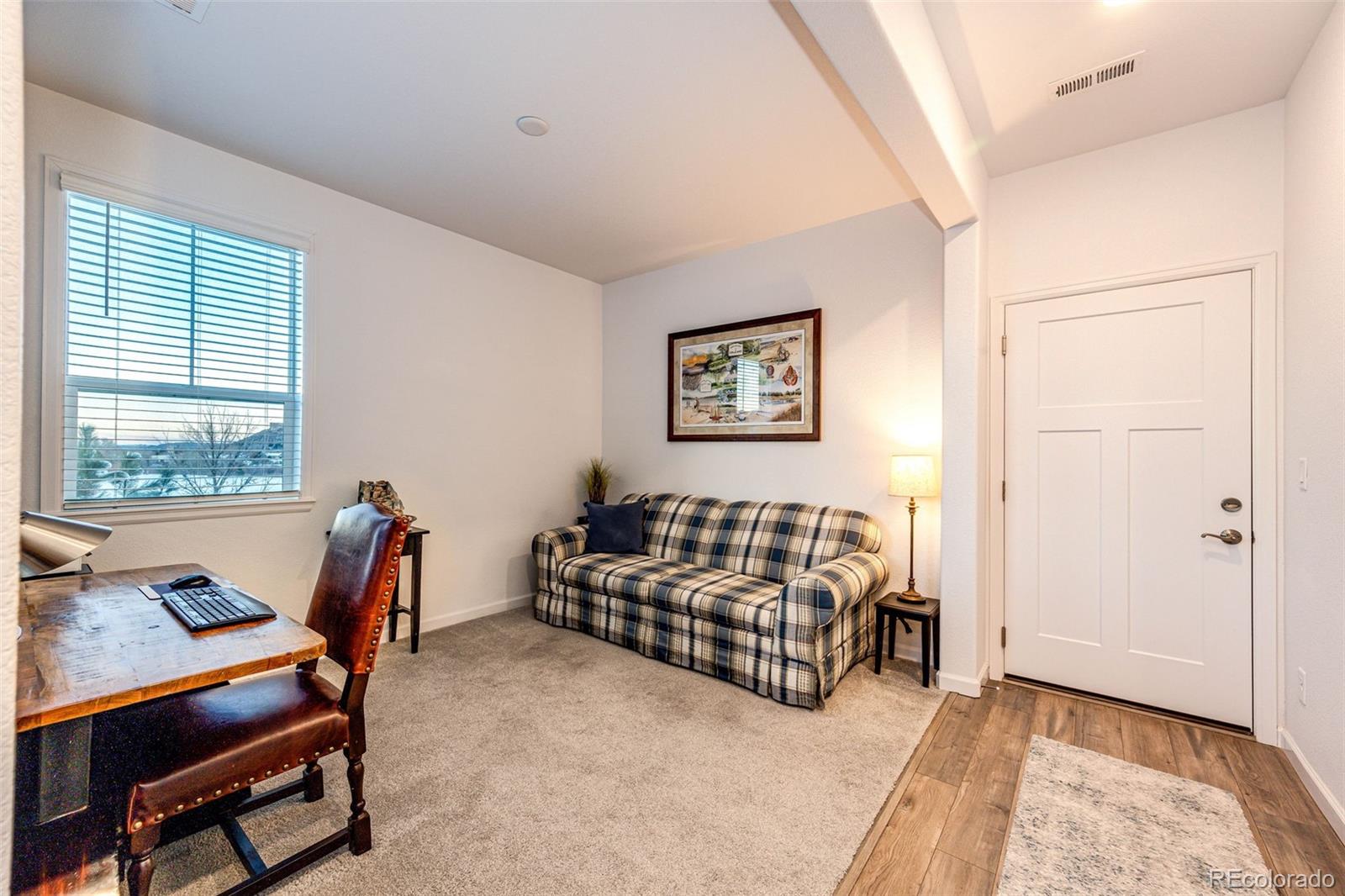 1532 Castle Creek Circle Castle Rock, CO 80104 - Photo 4 of 39 a living room with furniture and a window