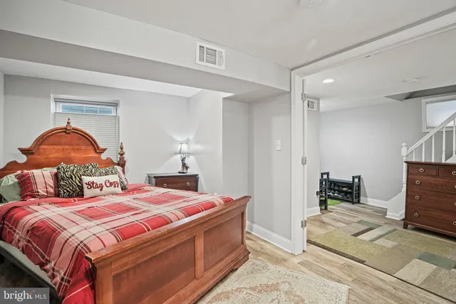 a bedroom with double bed and a window