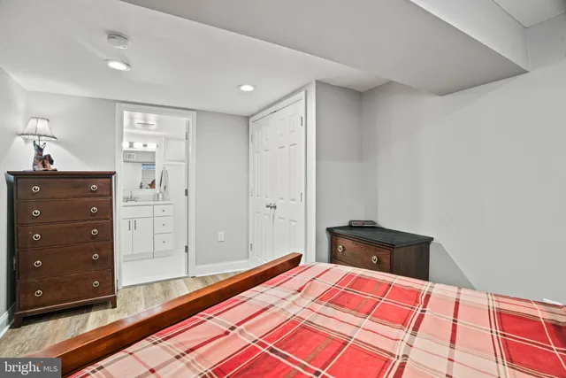 a bedroom with a bed and a dresser