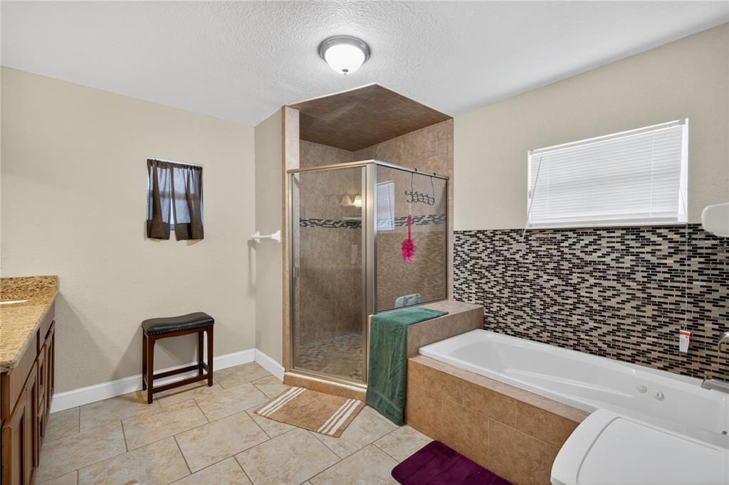 1922 Matthew Court Lakeland, FL 33813 - Photo 13 of 41 a bathroom with a toilet and a shower