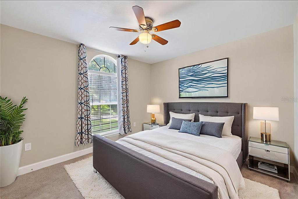 1922 Matthew Court Lakeland, FL 33813 - Photo 15 of 41 a bedroom with a large bed and a window