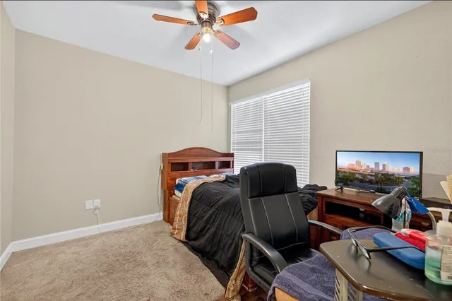 a bedroom with furniture and a window