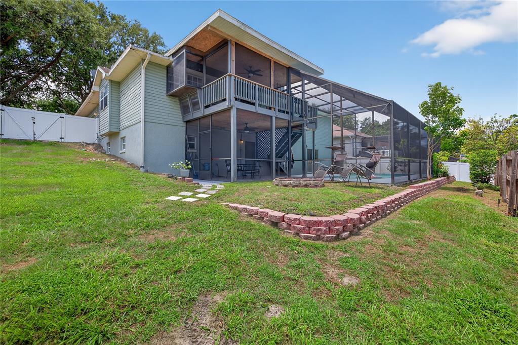 1922 Matthew Court Lakeland, FL 33813 - Photo 37 of 41 a view of a house with a swimming pool and a yard