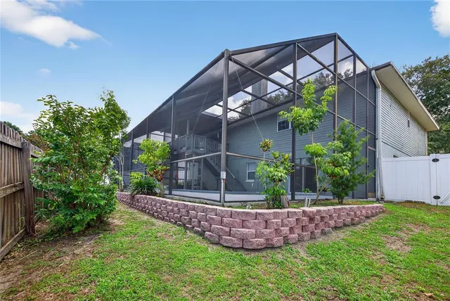 an aerial view of a house having yard patio and deck