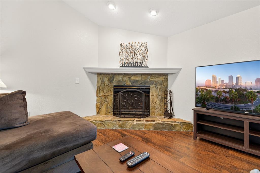 1922 Matthew Court Lakeland, FL 33813 - Photo 4 of 41 a living room with furniture and a fireplace