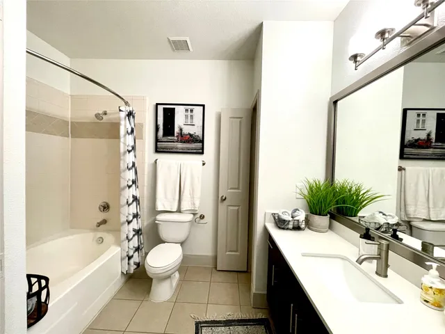 a bathroom with a sink a toilet and a bathtub