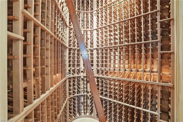 a kitchen with granite countertop a sink and white cabinets