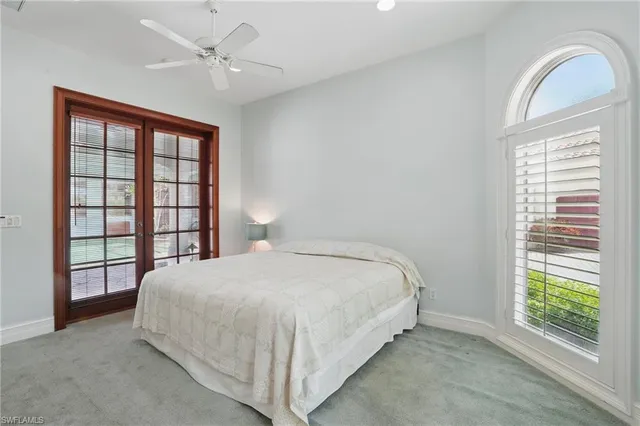 a swimming pool with outdoor seating and yard