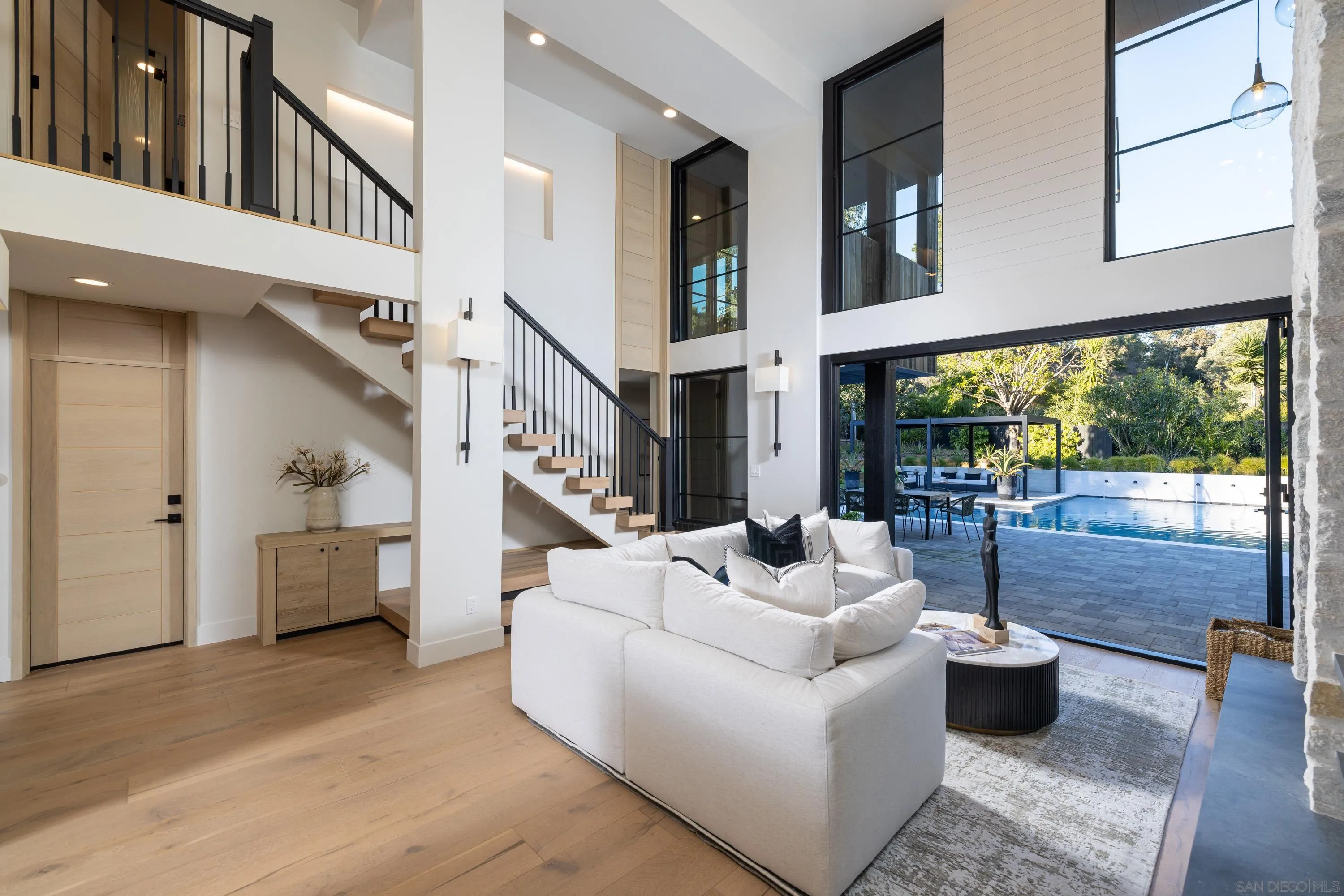 4954 Sun Valley Road Del Mar, CA 92014 - Photo 11 of 31 a living room with furniture and a floor to ceiling window