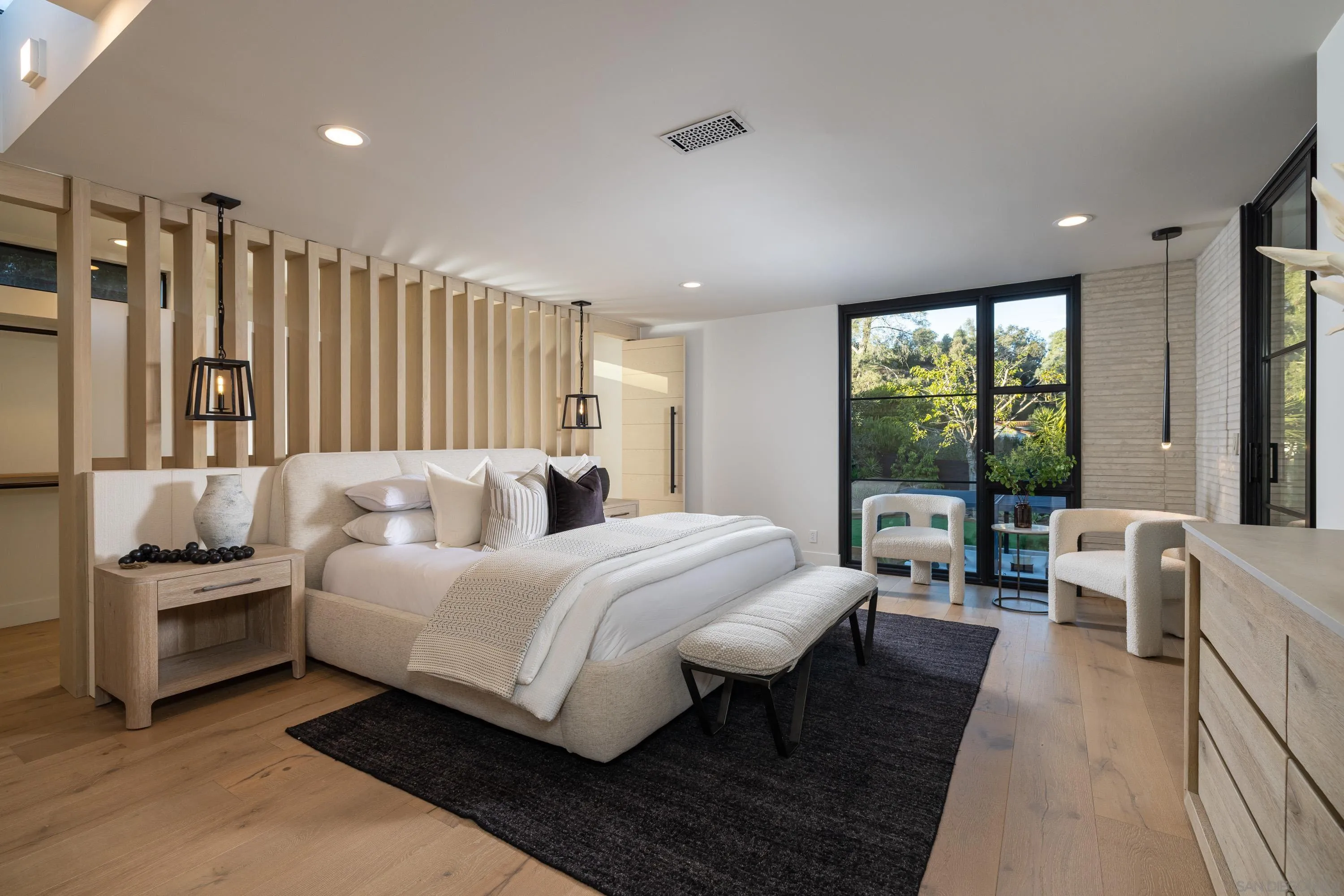 4954 Sun Valley Road Del Mar, CA 92014 - Photo 15 of 31 a bedroom with a large bed and a large window