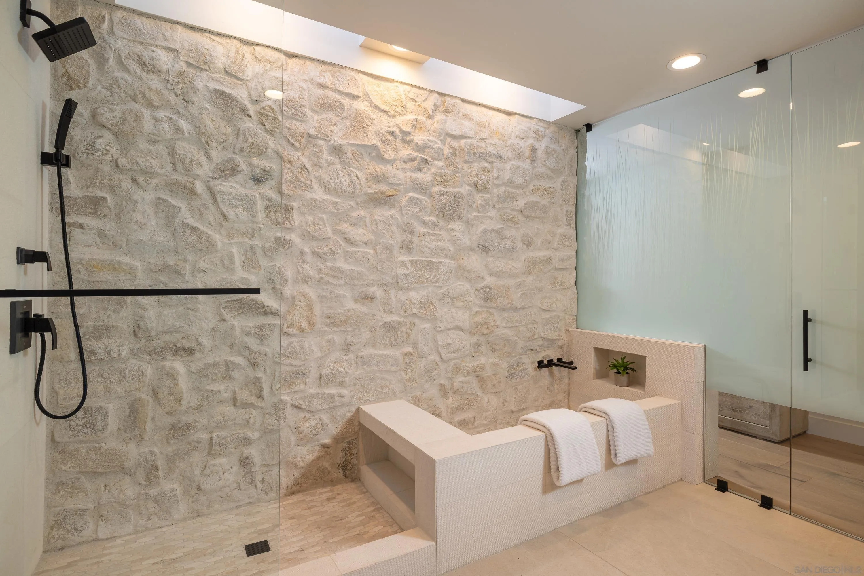 4954 Sun Valley Road Del Mar, CA 92014 - Photo 16 of 31 a bathroom with a bathtub and shower