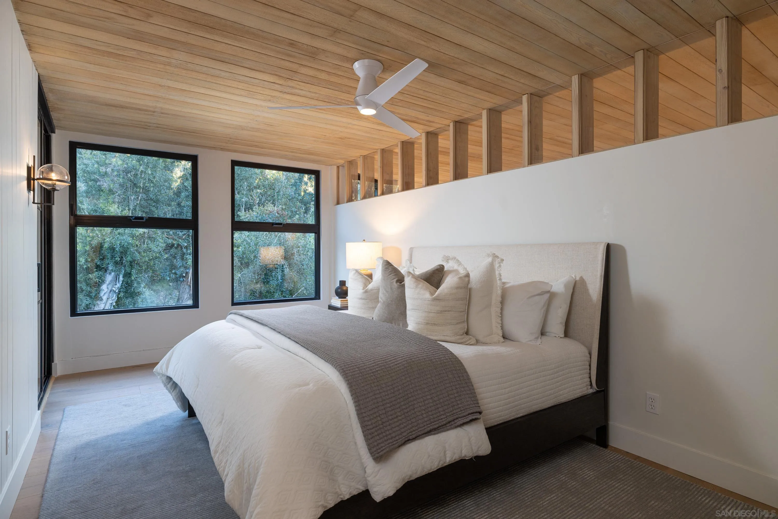 4954 Sun Valley Road Del Mar, CA 92014 - Photo 19 of 31 a bed sitting in a bedroom next to a window