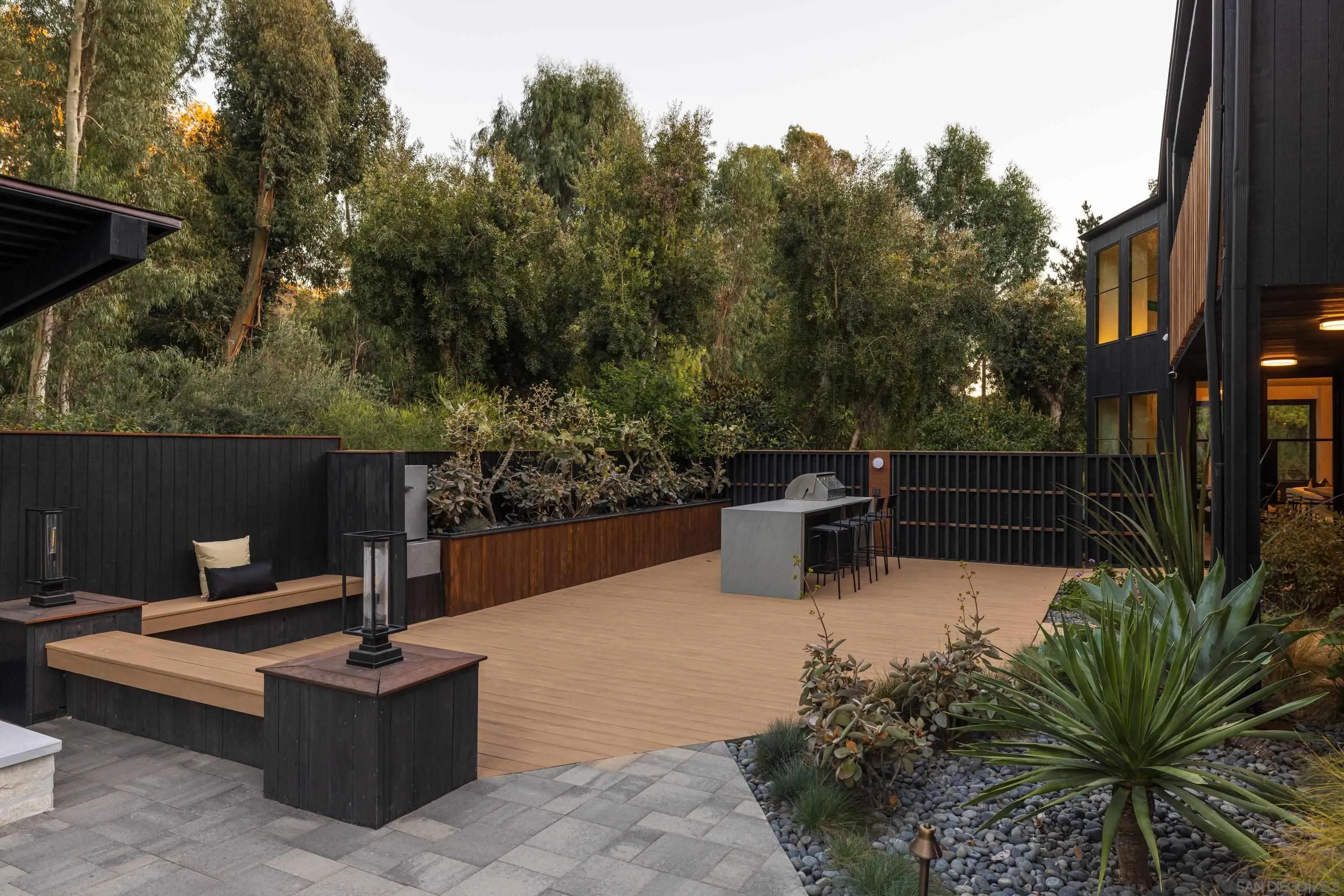 4954 Sun Valley Road Del Mar, CA 92014 - Photo 25 of 31 a view of a chairs and tables in the back yard of the house