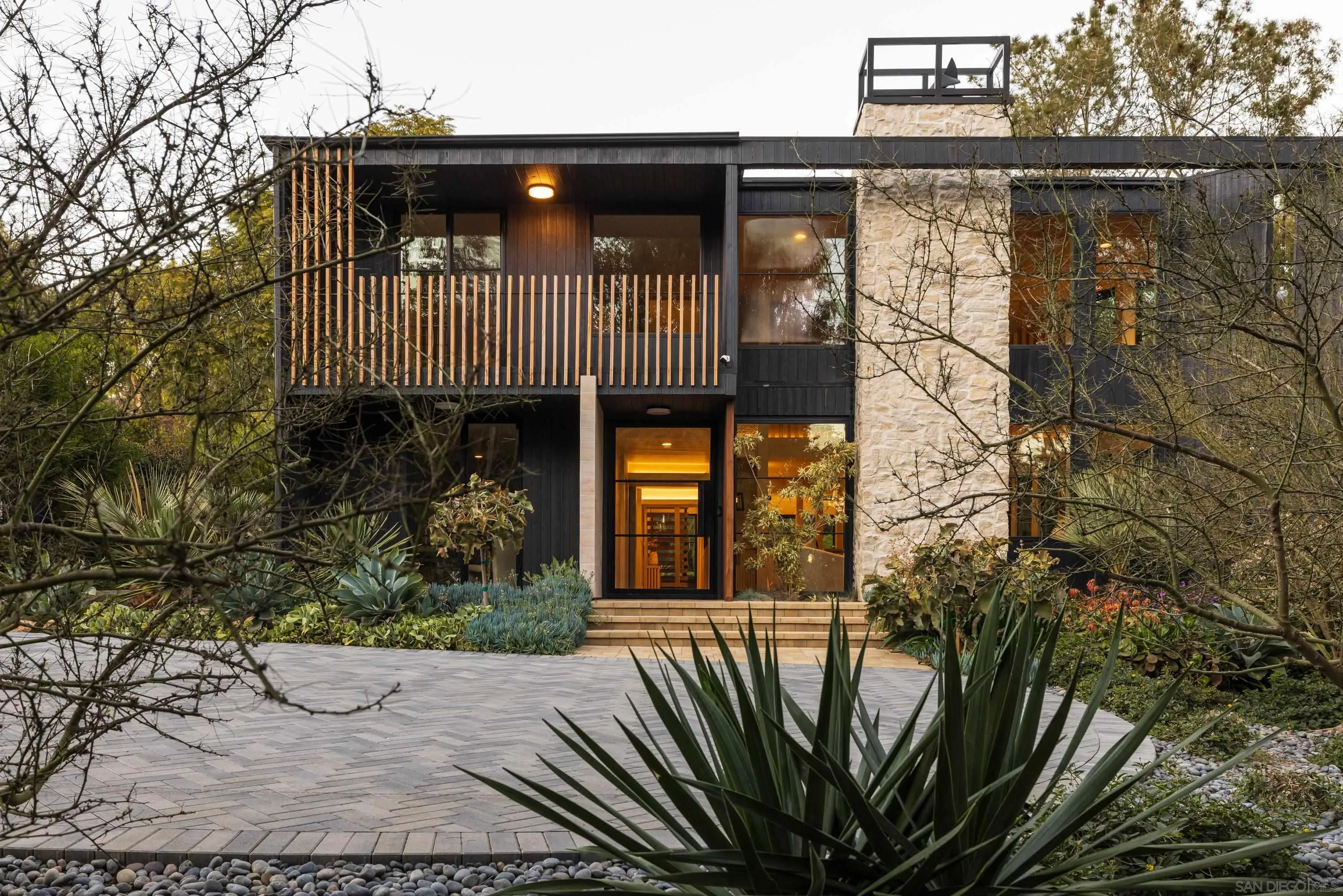 4954 Sun Valley Road Del Mar, CA 92014 - Photo 27 of 31 a front view of a house with garden