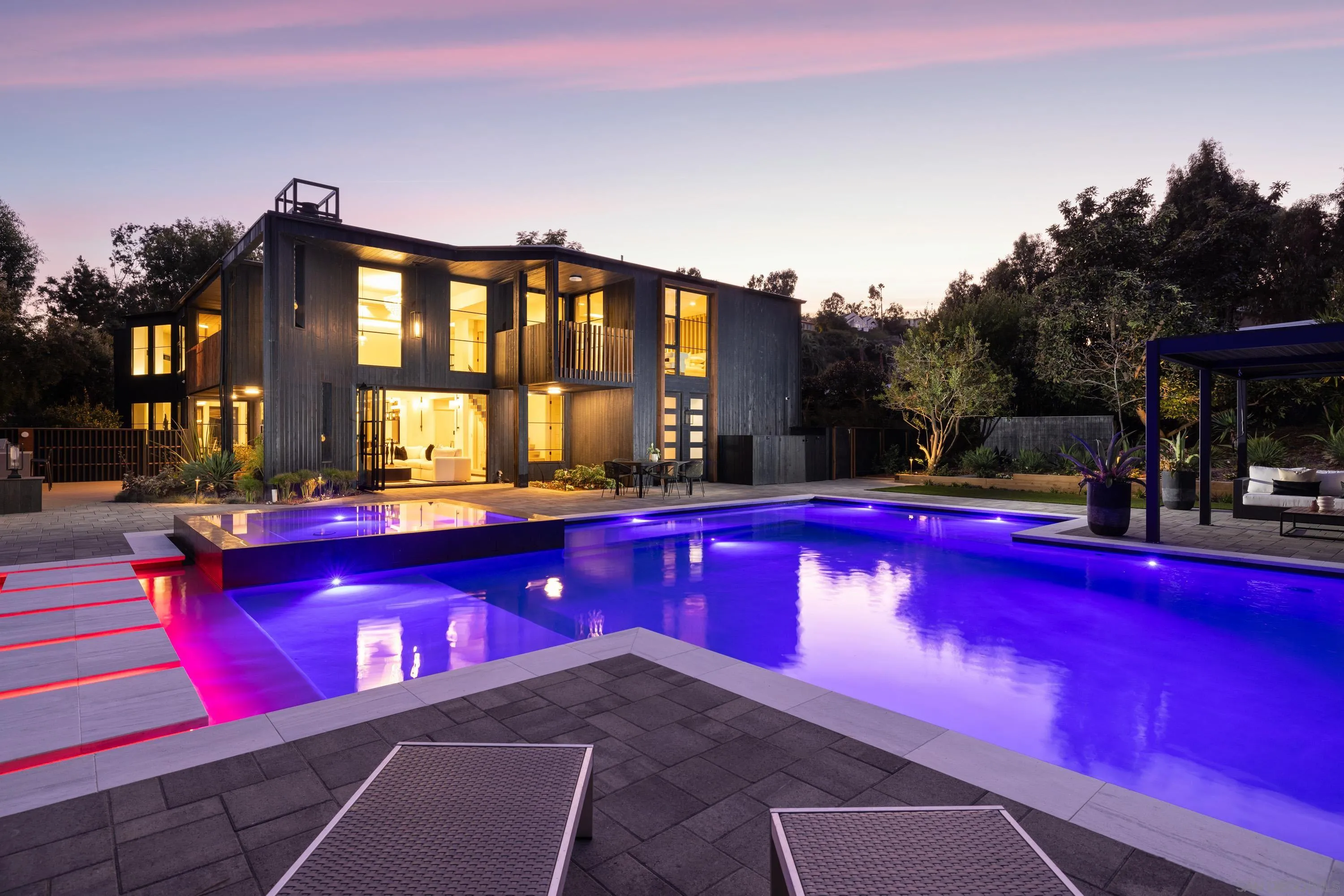 4954 Sun Valley Road Del Mar, CA 92014 - Photo 3 of 31 a view of swimming pool with red chairs