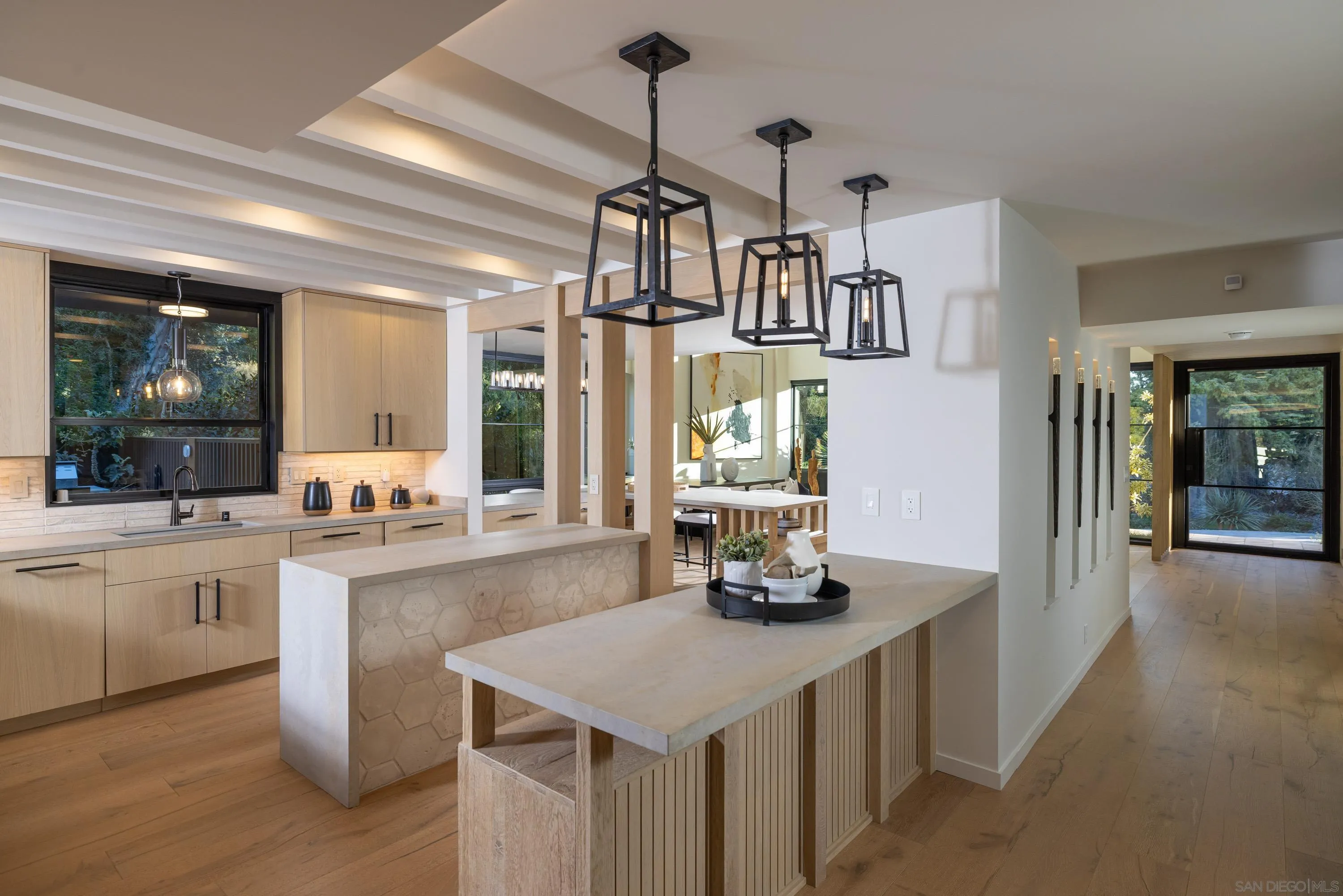 4954 Sun Valley Road Del Mar, CA 92014 - Photo 9 of 31 a kitchen with stainless steel appliances a sink stove and wooden floor