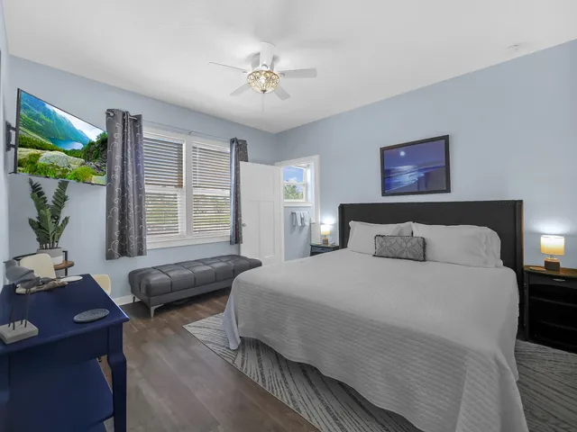 a bedroom with a bed and a couch