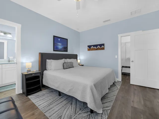 a bedroom with bed and a window