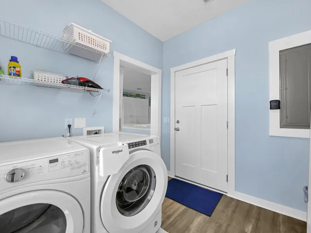 a view of storage and utility room with utility and washer