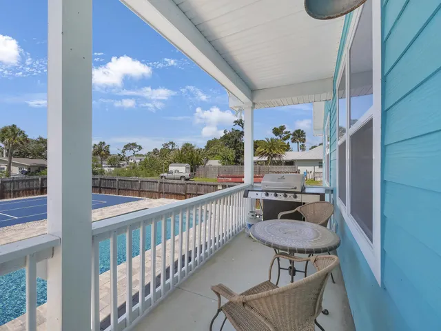 a view of a balcony with chairs
