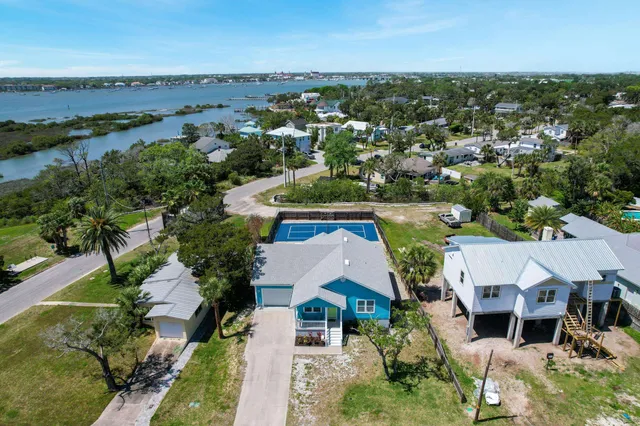 an aerial view of residential houses with outdoor space