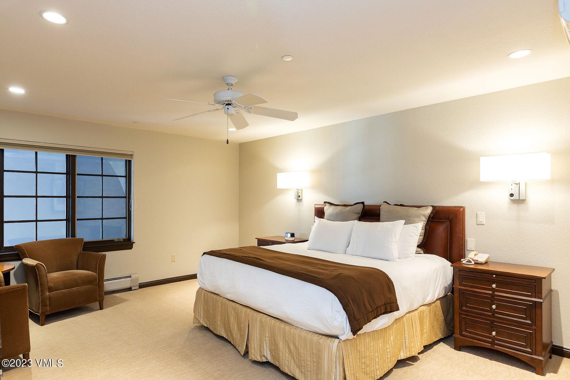 210 Offerson Road, Unit R115 WEEK 49 Beaver Creek, CO 81620 - Photo 12 of 30 a bedroom with a bed and a couch