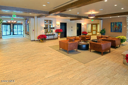 210 Offerson Road, Unit R115 WEEK 49 Beaver Creek, CO 81620 - Photo 25 of 30 a living room with furniture a window and kitchen view