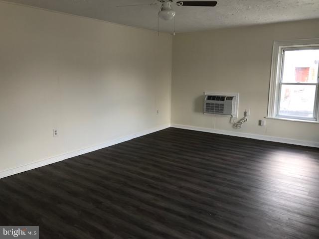 146 Pleasant Street Hanover, PA 17331 - Photo 12 of 13 an empty room with wooden floor and windows