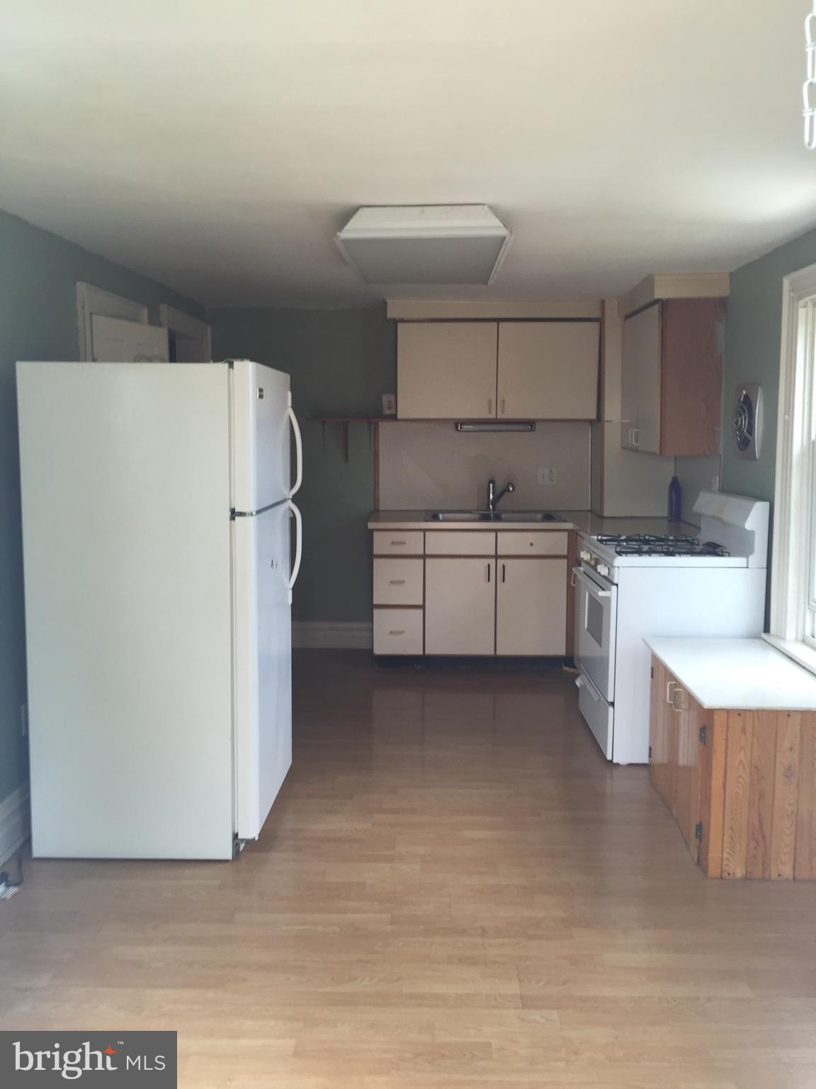 146 Pleasant Street Hanover, PA 17331 - Photo 6 of 13 a kitchen with a refrigerator a sink and dishwasher