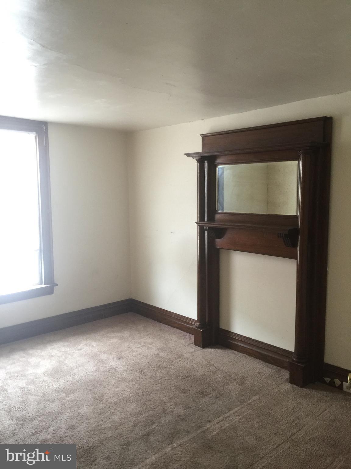 146 Pleasant Street Hanover, PA 17331 - Photo 7 of 13 an empty room with windows