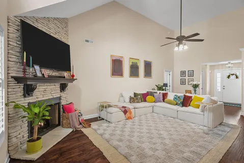 a living room with furniture and a flat screen tv