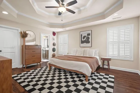 a spacious bedroom with a bed and a walk in closet