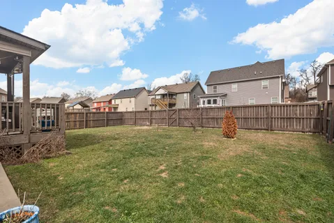 a view of a green field with a yard
