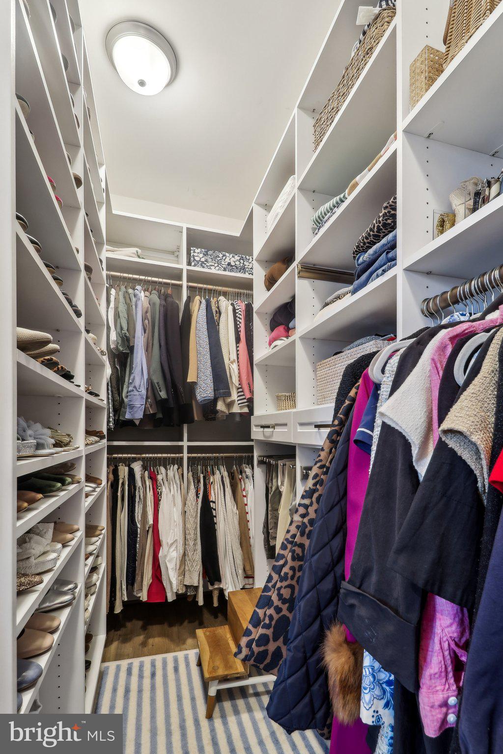2256 South Glebe Road Arlington, VA 22206 - Photo 27 of 53 a view of walk in closet with clothes and shoes