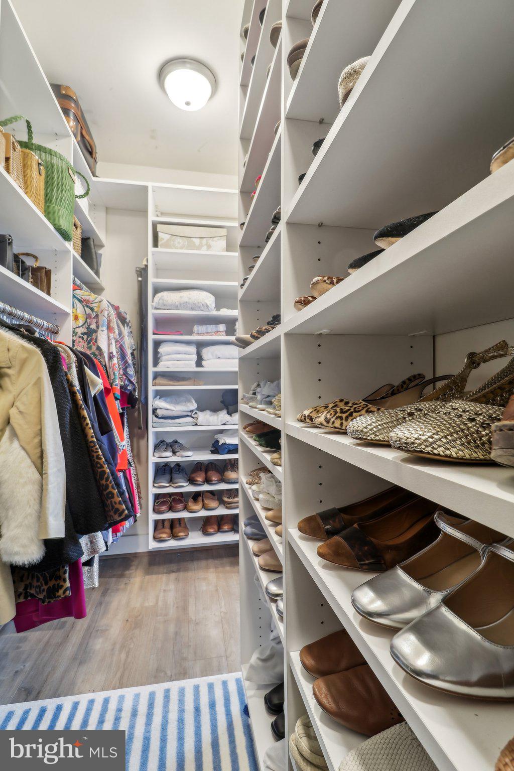 2256 South Glebe Road Arlington, VA 22206 - Photo 28 of 53 a view of walk in closet with clothes and shoes