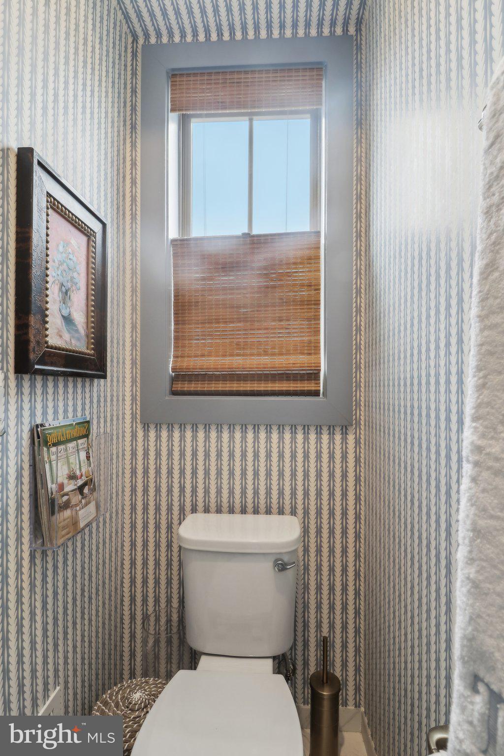 2256 South Glebe Road Arlington, VA 22206 - Photo 32 of 53 a white toilet sitting next to a bathroom sink