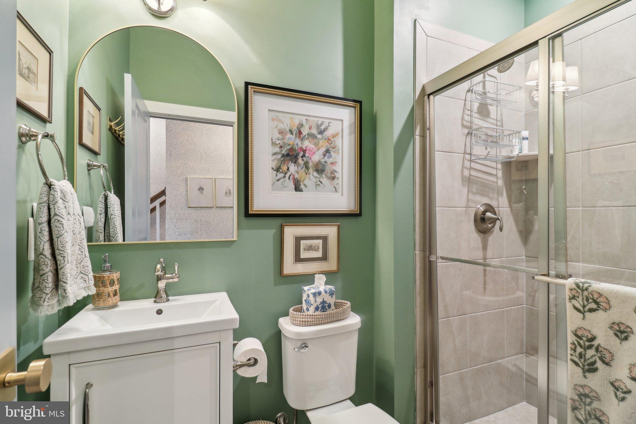 2256 South Glebe Road Arlington, VA 22206 - Photo 10 of 53 a bathroom with a sink mirror toilet and next to a window