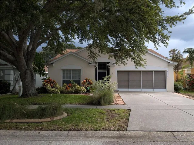 front view of a house with a garden