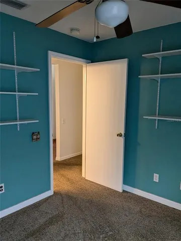 an empty room with a mirror